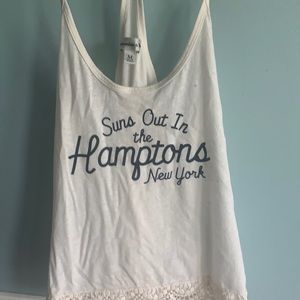 Cream colored tank top with quote from Abercrombie
